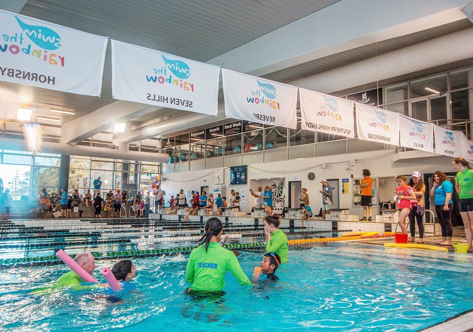 2019 Carnival with teachers, swimmers, families and Club banners