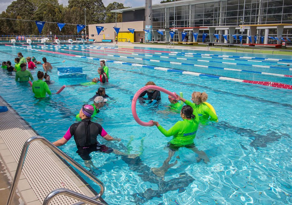 Swim Teachers in pool at Rainbow Connect